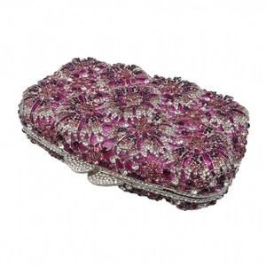 Detailed macro view of purple floral rhinestone pattern on evening clutch bag with metal frame