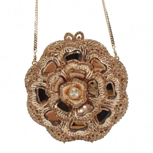 Detailed macro view of hollow flower dinner clutch bag with brown crystals and gold chain