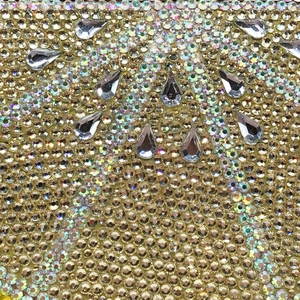 Sparkling lemon-shaped clutch bag featuring dense gold rhinestones and silver crystals