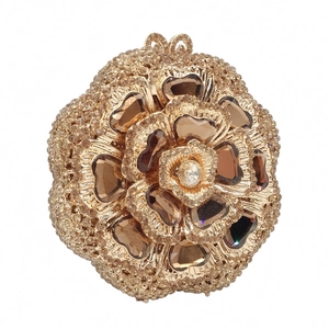 Detailed macro view of champagne gold floral evening clutch with crystal rhinestones