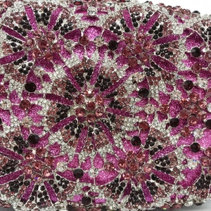 Close-up of rose red evening bag showing intricate multi-color rhinestone flower pattern