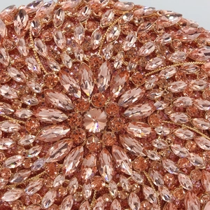 Elegant rose gold evening clutch bag with marquise-cut crystals in a radial luxury pattern