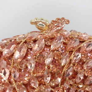 Elegant rose gold evening clutch with crystal rhinestones and bird-shaped clasp