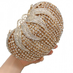 Handheld butterfly shaped evening clutch bag fully embellished with white rhinestones