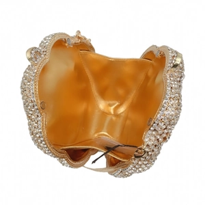 Top view of hollow rhinestone evening clutch showing gold interior and metal chain