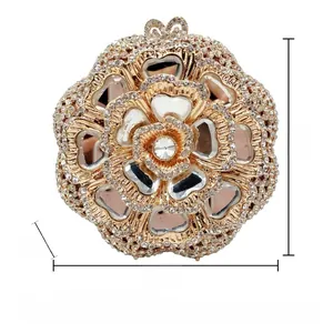 Detailed view of floral rhinestone evening bag measuring 14x14x6cm in champagne gold