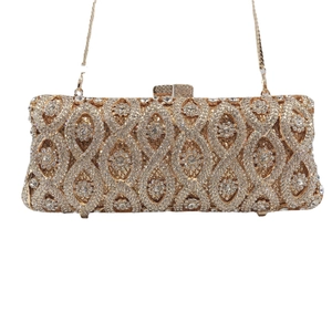 Elegant gold metal evening clutch bag with sparkling crystals and a fine chain strap