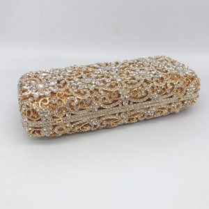 Detailed view of hollow out gold metal evening clutch bag with sparkling rhinestones