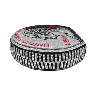 Macro detail of luxury coin-shaped evening bag with inlaid rhinestones and striped side