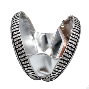 Macro detail of rhinestone evening clutch with silver lining and interior storage