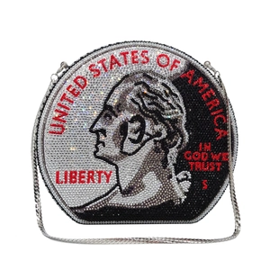 Detailed macro view of US coin pattern on a sparkling rhinestone round evening clutch bag