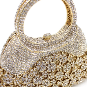 Luxury gold metal evening clutch bag with sparkling rhinestones and hollow floral patterns