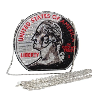 Detailed view of round rhinestone evening bag with silver coin design and metal chain