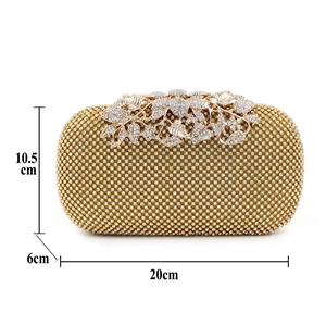 Detailed view of leaf clasp on crystal evening clutch with dimensions 20cm x 10.5cm x 6cm