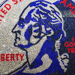 Macro shot of sparkling rhinestone coin detail on red white and blue evening clutch bag