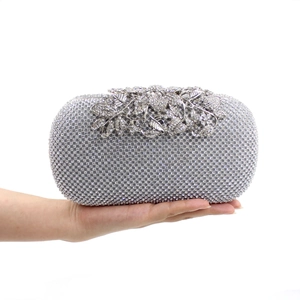 Silver rectangle evening clutch with luxury crystal rhinestones and floral leaf clasp