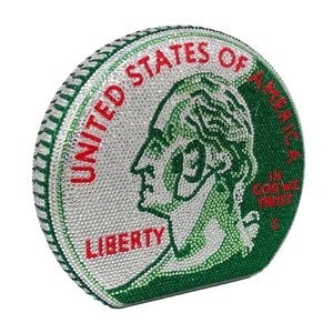 Macro detail of coin-shaped evening bag with green and white rhinestones and metal clasp