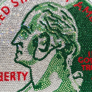 Macro detail of sparkling crystal rhinestones on a round 25-cent coin themed evening bag