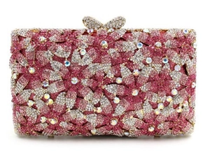 Detailed close-up of pink and silver floral crystal clutch with butterfly clasp