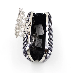 Interior view of black rhinestone clutch bag with silver chain strap and flower clasp