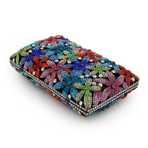 Close-up of colorful floral crystal rhinestones on a rectangular evening clutch bag
