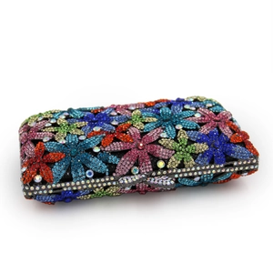 Detailed view of luxury evening clutch with multi-colored floral rhinestone patterns