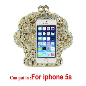 Detailed capacity view of the gold crystal flower clutch bag fitting an iPhone 5s
