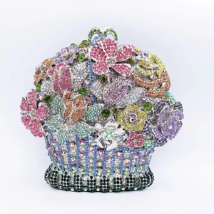 Macro shot of colorful floral crystal embellishments on a flower basket evening clutch bag