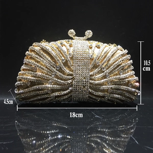 Detail view of a gold rhinestone evening clutch with size dimensions 18x10.5x4.5cm