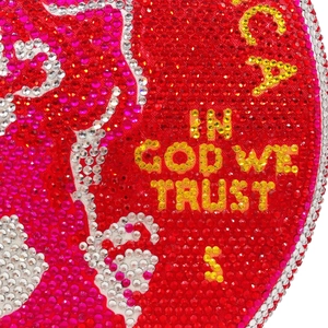 Macro detail of sparkling rhinestones on round evening bag with In God We Trust text