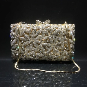 Exquisite floral rhinestone evening clutch featuring a golden bow clasp and metal chain