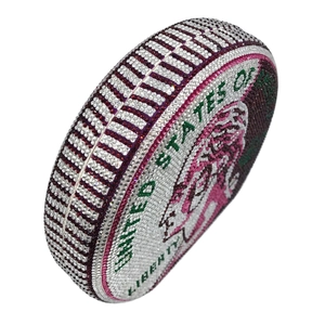 Close-up of circular crystal evening bag with Liberty coin design and colorful rhinestones