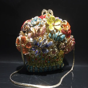 Detailed view of flower basket evening clutch featuring multi-color crystals and gold chain