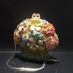 Detailed macro view of a floral crystal evening clutch with colorful rhinestone inlays