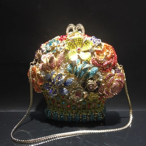 Detailed view of flower basket evening clutch with colorful crystals and gold handle