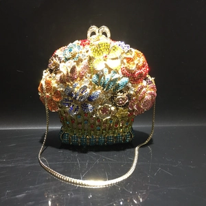 Detail of flower basket evening bag featuring colorful rhinestones and heart clasp