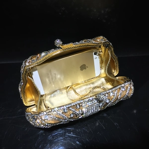 Golden rhinestone evening clutch bag with metal chain and crystal hollow design