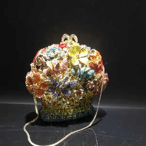 Detailed view of luxury flower basket clutch with colorful crystals and gold chain strap