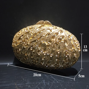 Detailed view of gold rhinestone evening clutch showing dimensions 20x13x5 cm