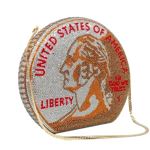 Macro shot of circular evening bag with sparkling rhinestones and US coin design