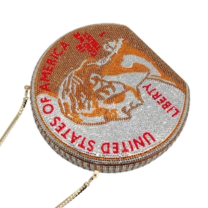 Macro view of crystal-encrusted round clutch bag featuring United States coin design