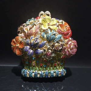 Detailed close-up of a floral basket shaped evening bag with colorful crystals and rhinestones