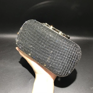 Detailed macro view of the sparkling crystal rhinestone clutch with silver metal clasp