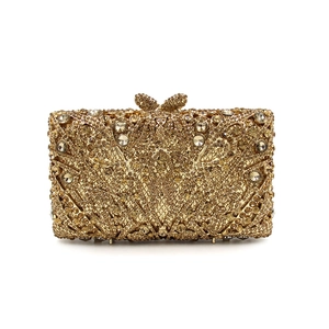 Luxury gold crystal evening clutch bag with rhinestone bow clasp for elegant gala attire