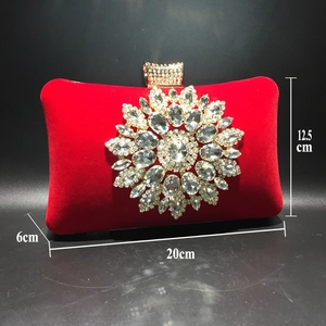 Detailed view of red velvet evening bag showing 20cm width, 12.5cm height, and 6cm depth