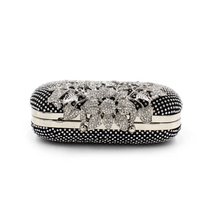 Detailed view of leaf floral crystal embellishments on the black evening clutch bag