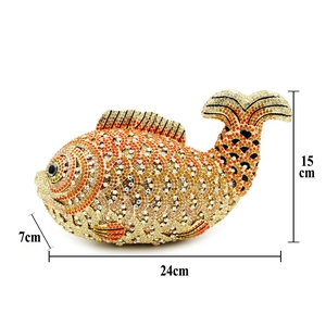 Macro shot showing dimensions of fish-shaped evening clutch with sparkling rhinestones