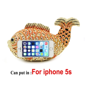 Detail view of goldfish crystal evening bag showing interior capacity for mobile phone