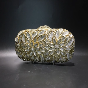 Detailed close-up of crystal evening clutch with intricate floral rhinestone patterns