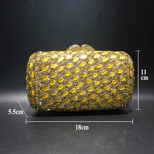 Detailed view of yellow rhinestone evening clutch with dimensions 18cm x 11cm x 5.5cm